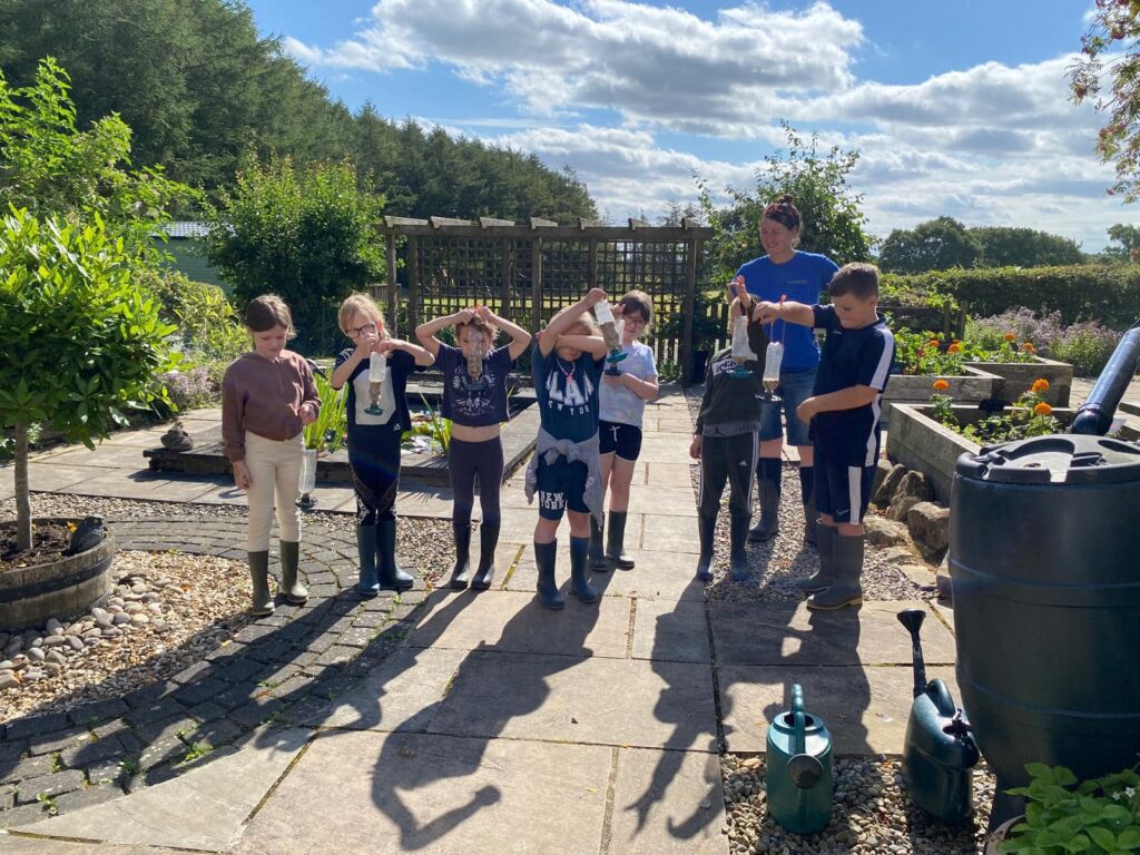 Kids with handmade bird feeders